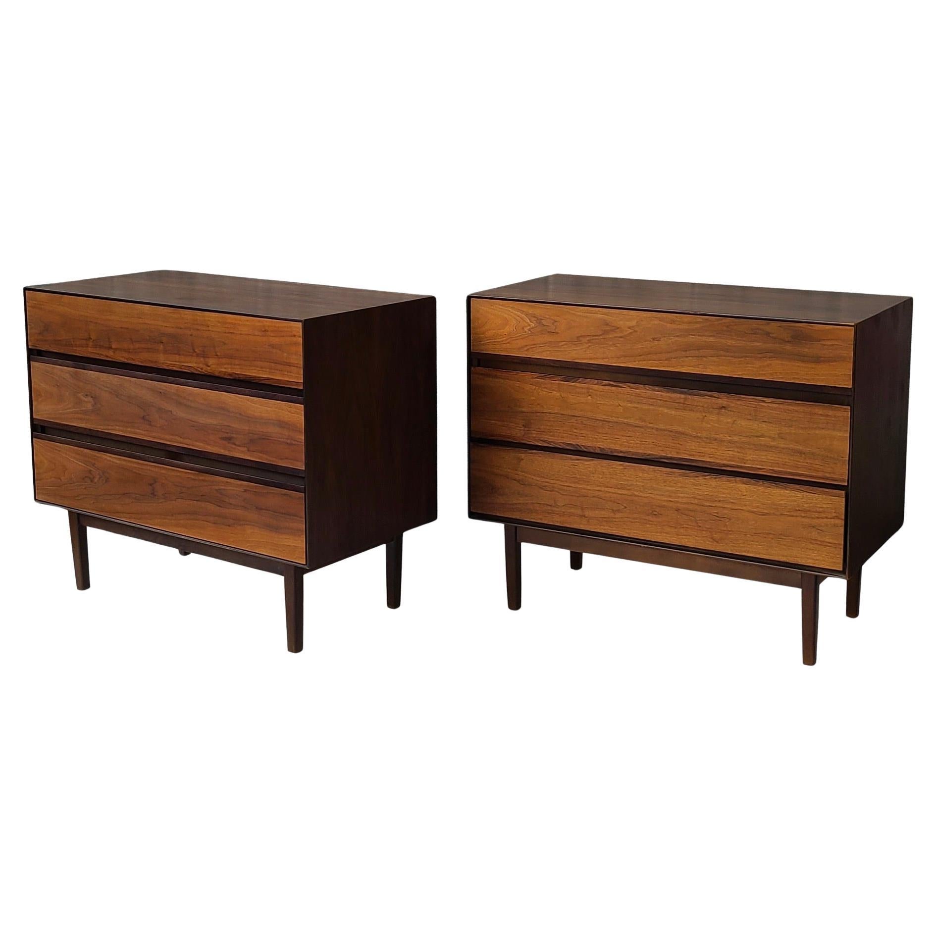 Pair Mid Century Modern 3 Drawer Chests by Stanley.
Walnut surrounds with rosewood trim at hidden drawer pulls.
Cleverly simple chests.