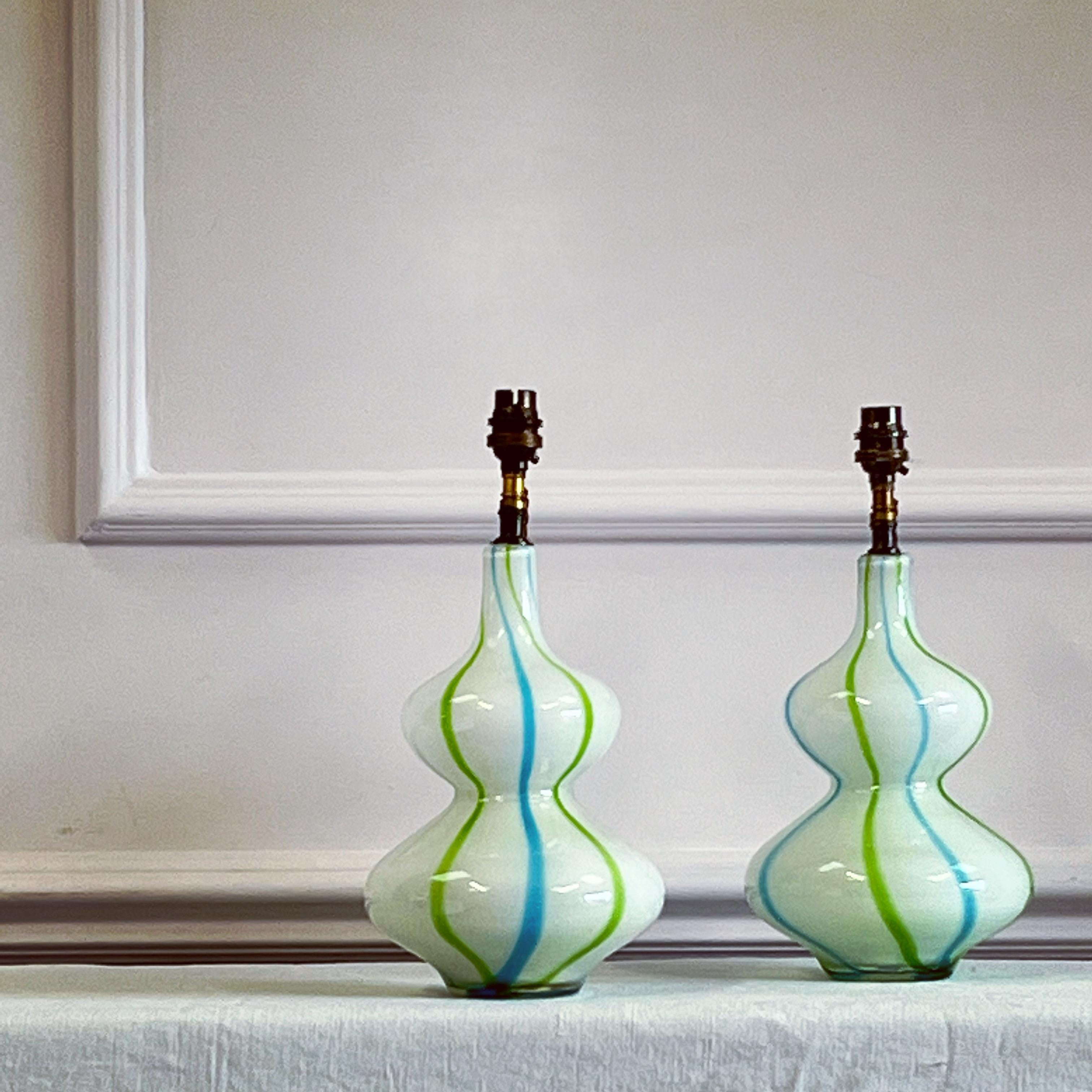A pair of mid twentieth century Murano glass vases of double gourd form, with white ground and vertical twisted aventurine and acquamarine stripe.