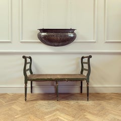 An Arts and Crafts Polished Steel Wall Planter