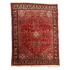 Tapis persan antique à médaillon