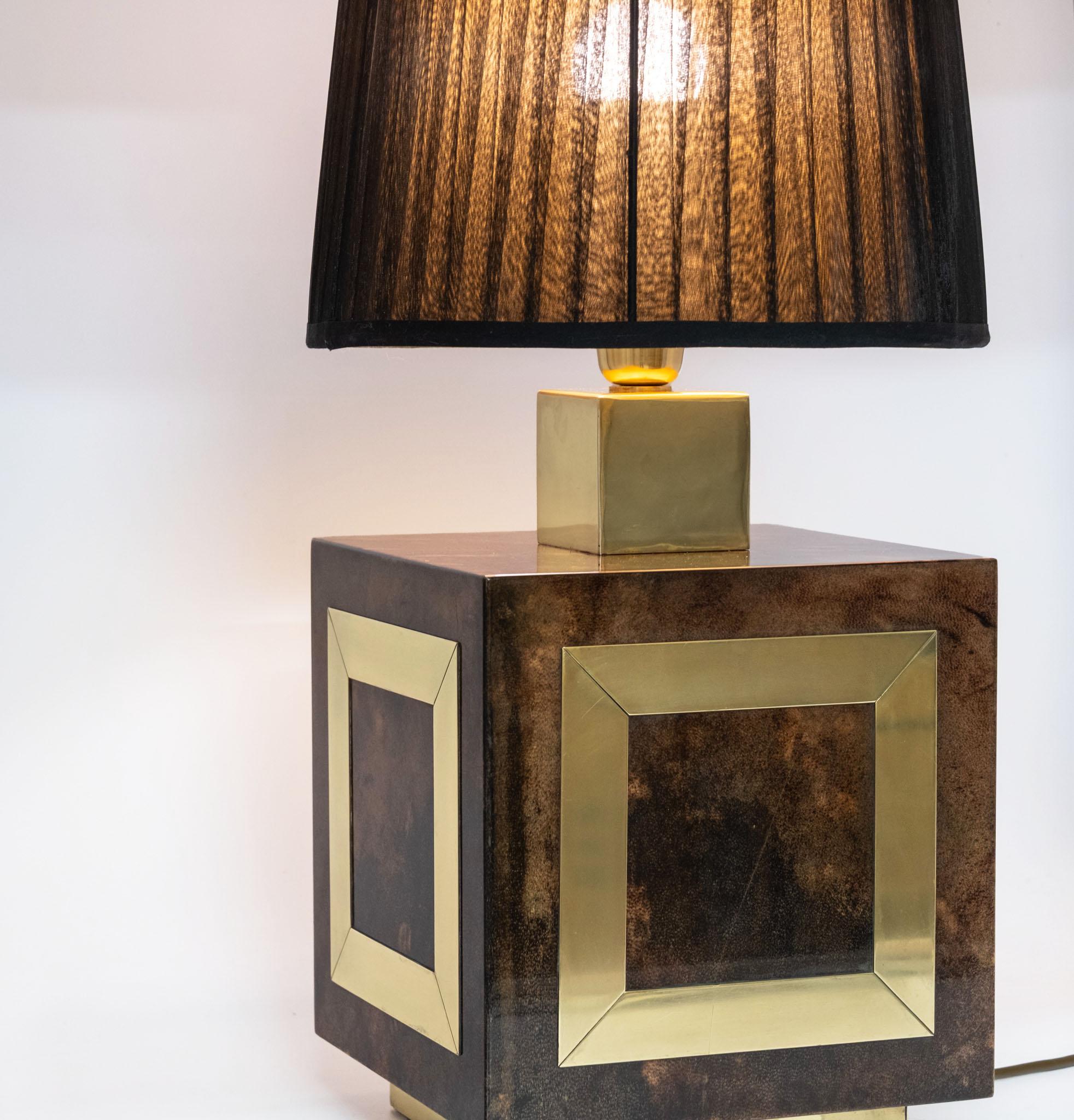 Mid Century Italian lacquered vellum & polished brass large table lamp with shade. Attributed to Aldo Tura (1909–1963). Circa 1960.

The lamp base is in good condition, showing some signs of use to the lacquer. There are a few small nibbles to a