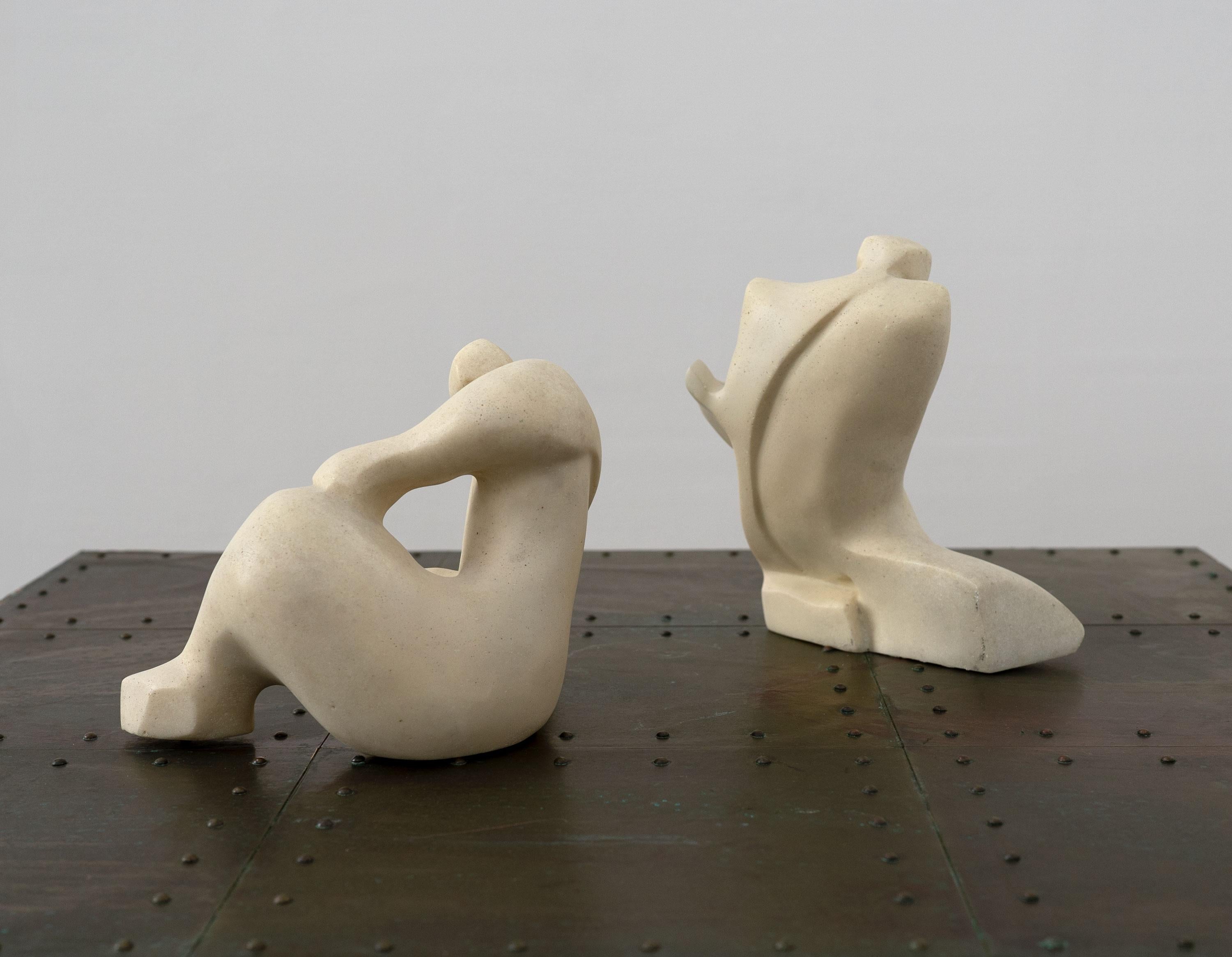 Two vintage abstract sculptures depicting kneeling figures. Made from cast composite stone.

Priced per piece.

Dimensions (cm, approx):
Height: 25
Width: 25
Depth: 12

In good condition with only very minor imperfections. 