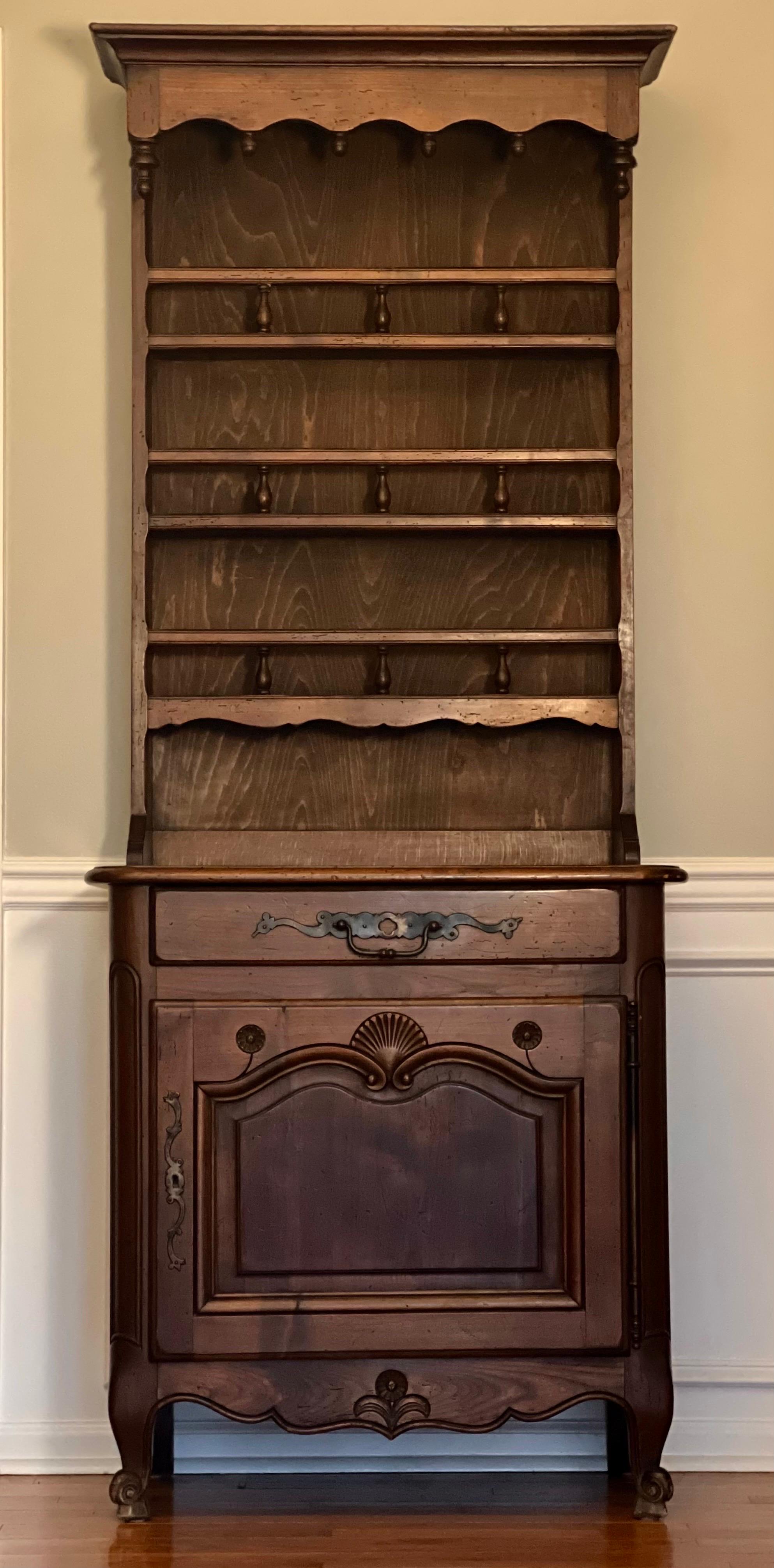 Louis XV style solid oak hutch dresser, France circa early 20th century.

Wonderful slim cupboard crafted in France for Bloomingdale's. It features a large dovetailed drawer with an elaborate, oversized pull and original paisley floral lining. A