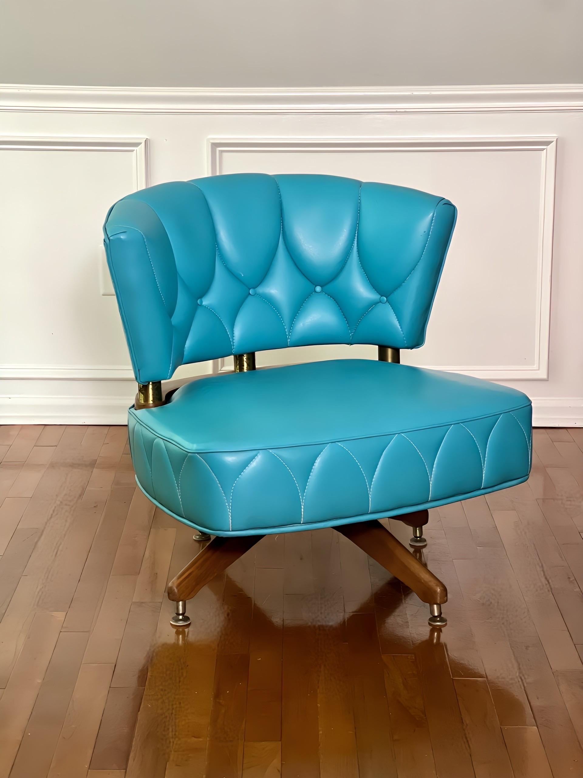 Vintage swivel lounge chair by Kroehler, 1962.  Chic chair upholstered in a classic midcentury turquoise faux leather with unique stitching pattern detail.  A generous and comfortable seat swivels 360 degrees on a hearty four-legged wood base.  The