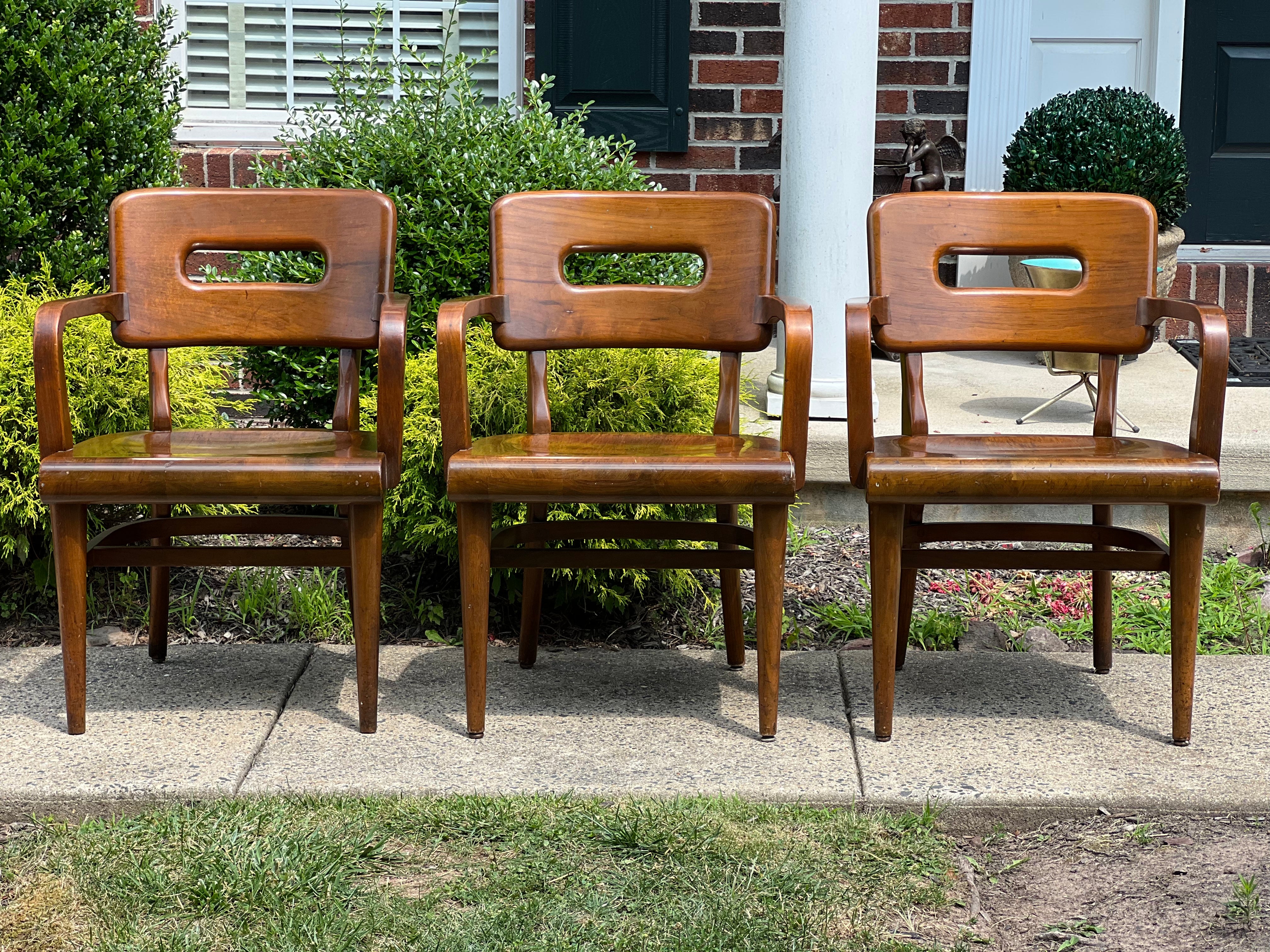 Set of 3 vintage Gunlocke walnut arm/side chairs with original tags. From a rectory in New York City, each chair exhibits exquisite craftsmanship and clean lines. Beautiful set In very good condition.