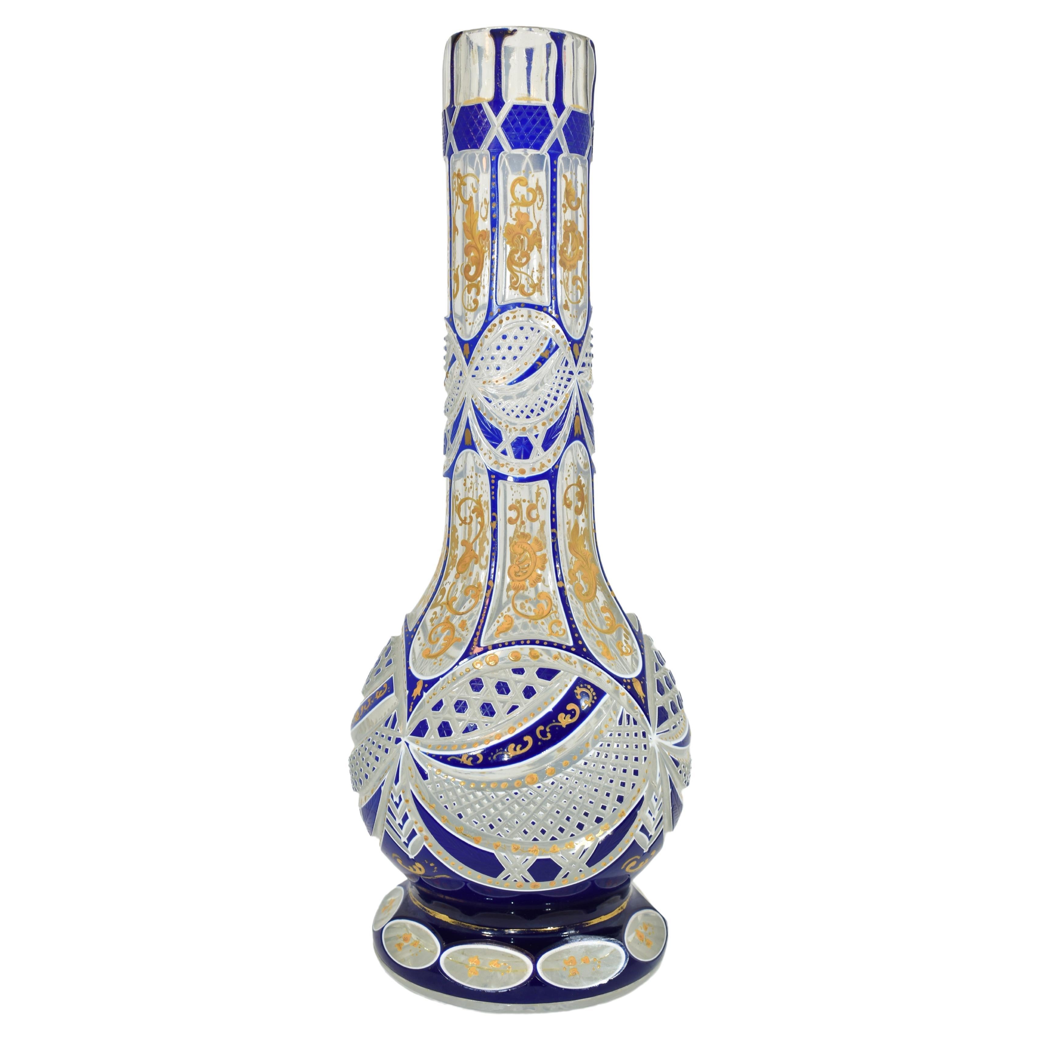Large antique double overlay glass hookah base (huqqa)
Bohemia, 19th century
Glass richly cut in various shapes and decorated all around with gilded enamel
Made for the Islamic market (Ottoman or Persian)

Height (32 cm)
Diameter (12.5 cm).