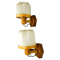 Pair of articulated "Cocoon" wall lights, resin and pine, Italy, Circa 1970
