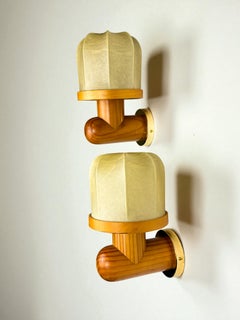 Pair of Italian "Cocoon" wall lights, resin and pine wood, 1970s