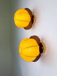 Pair of Italian "Cocoon" wall lights, resin and pine wood, 1970
