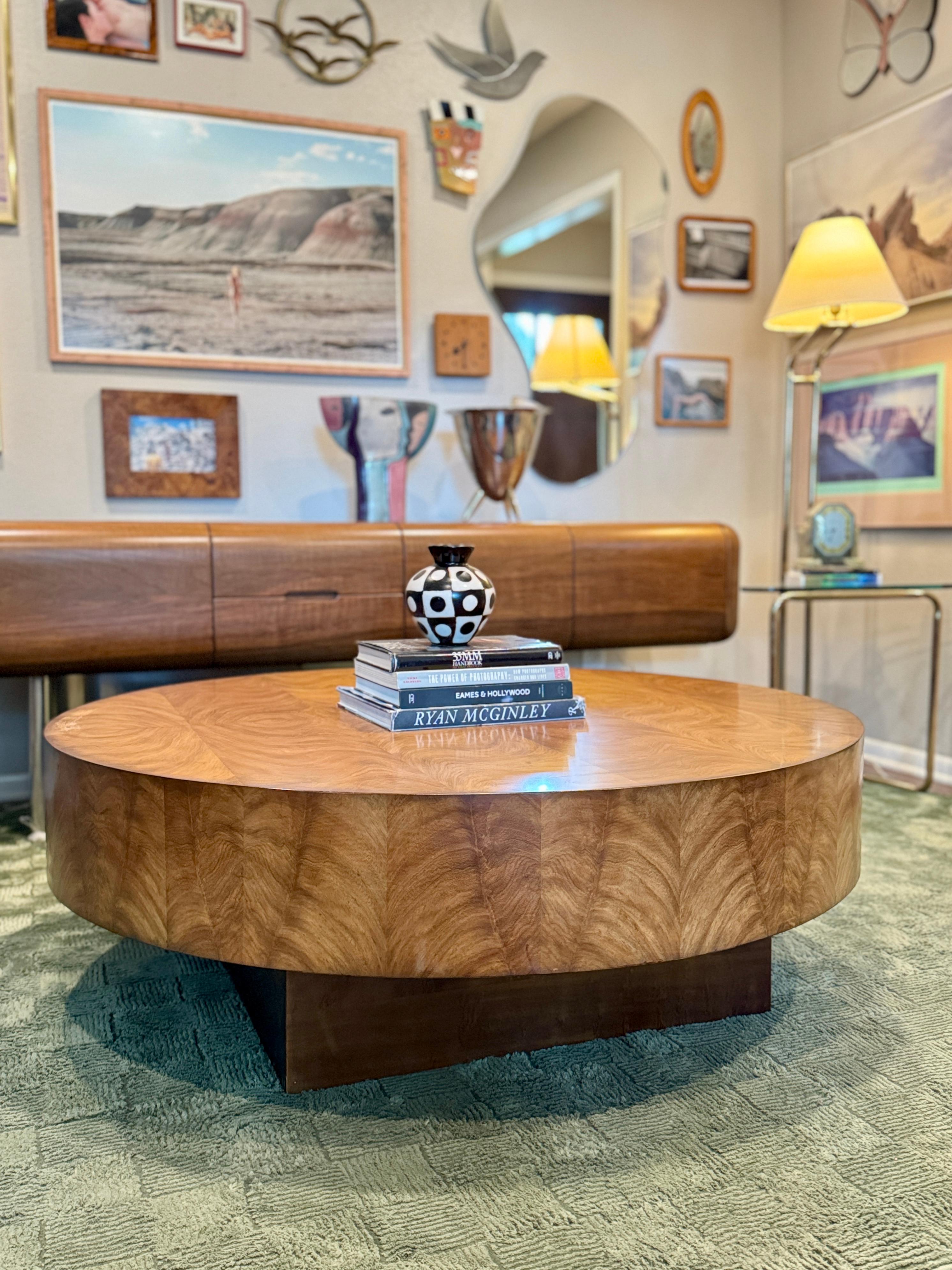 Gorgeous art deco style floating burl wood coffee table with a plinthe base. The wood pattern in this piece is absolutely beautiful and guaranteed to add a luxe factor to your living space. Would also look amazing as a centerpiece in a lobby or