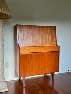 A cute mid century secretary desk/cabinet made by Elliots of Newbury, circa 1960