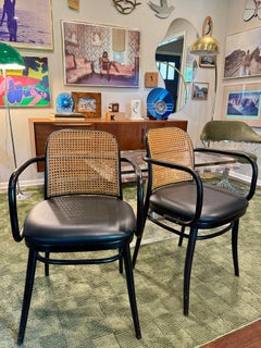 A pair of rare vintage black and tan bentwood thonet chairs by Josef Hoffman