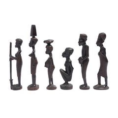 Carved Kenyan ebony village figures, set of six, 1950-70