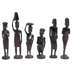 Carved Kenyan ebony village figures, set of six, 1950-70