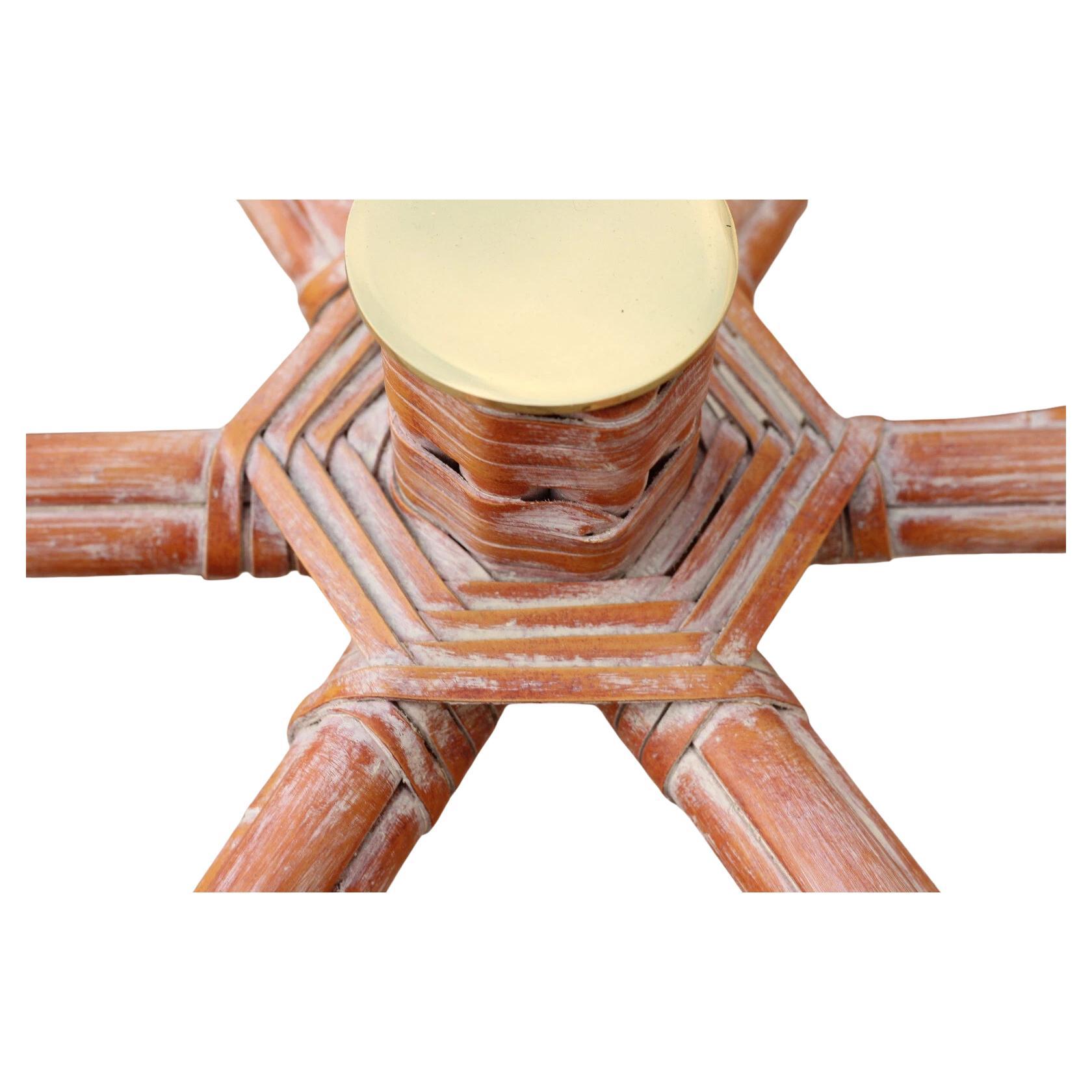 Stunning genuine McGuire organic modern bamboo rattan hexagonal dining table or center table base. This organic modern table base includes seven optional brass caps and was designed to be used with a round glass top. This beautiful piece is genuine