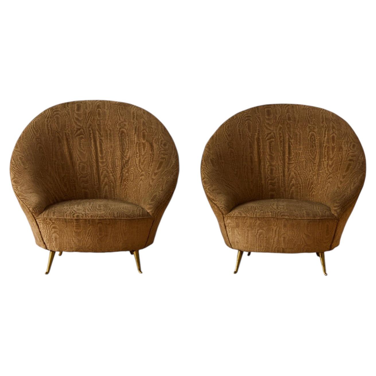 Paire de fauteuils signée ISA.