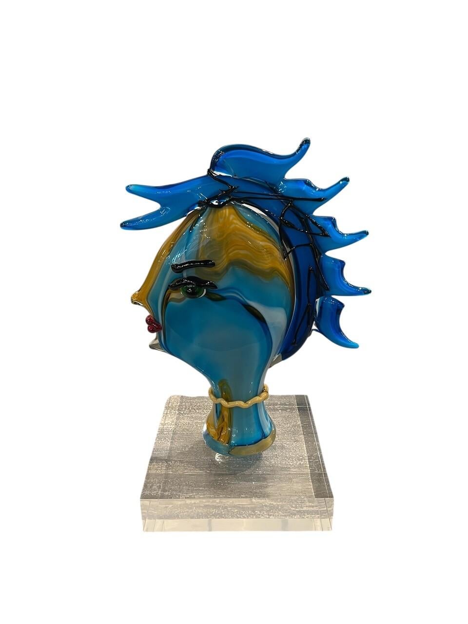Abstract Murano Sculpture Picasso Style. Multi color glass of female face in the style of Picasso sitting on a thick, clear Lucite Base