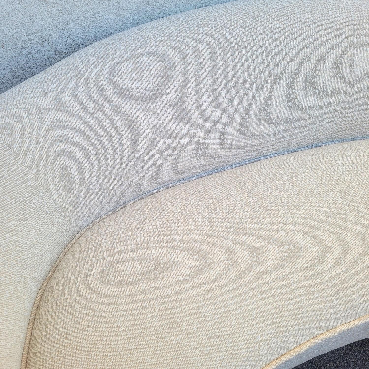 In the style of Jean Royère, polar bear style sofa, covered in white bouclé fabric on a cream background.  

 Very good condition / tiny traces of use

Height 78cm, seat 42cm.  
248 x 114 cm approximately.