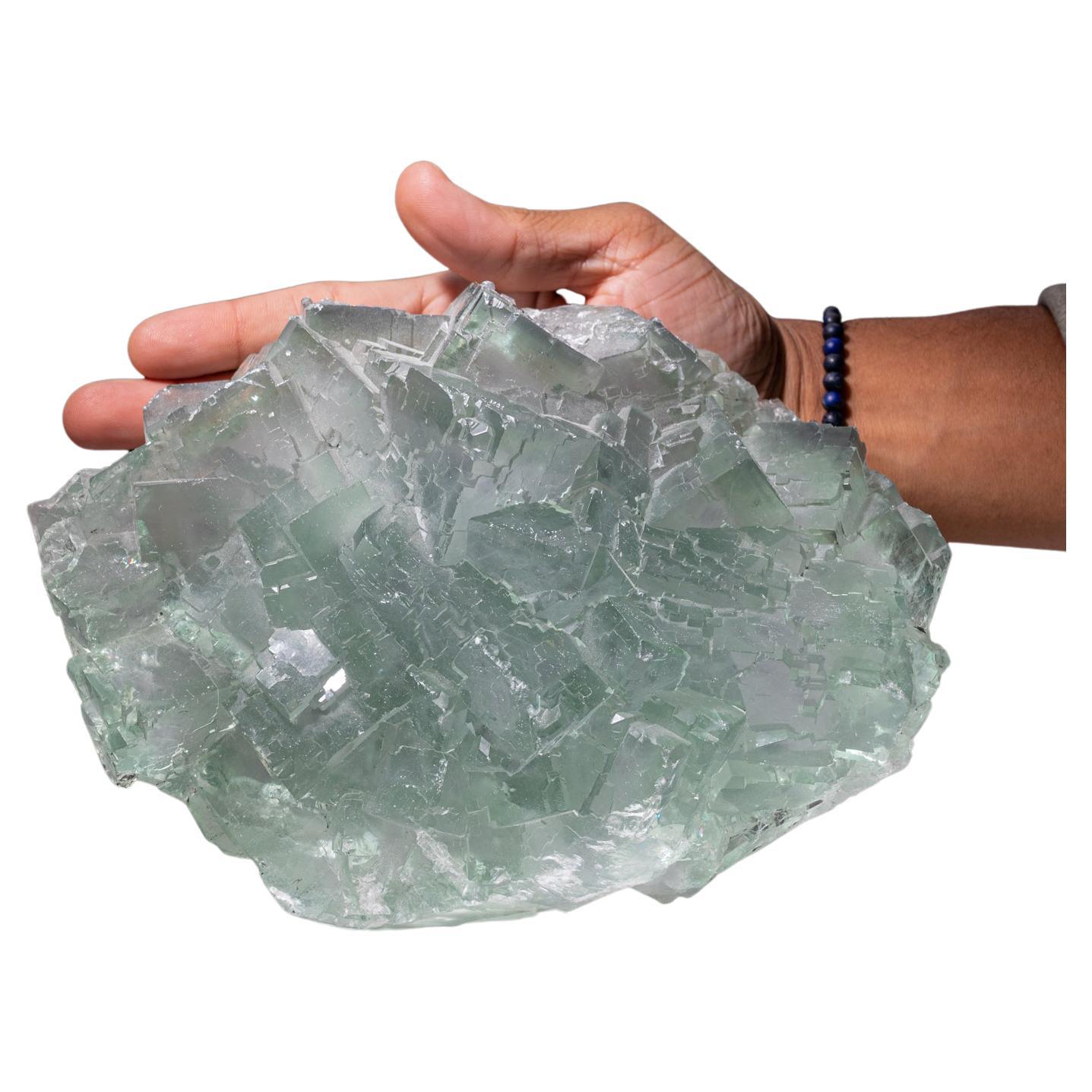 From Yaogangxian Mine, Nanling Mountains, Hunan Province, China.

Transparent cluster of light green fluorite crystals with glassy crystal surfaces gem green core with blue phantom zoning around the crystal terminations.

Weight: 9 lbs,