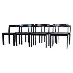 Set of eight black lacquered dining chairs