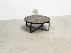 Round brutalist slate stone coffee table with ceramic inlaid tiles