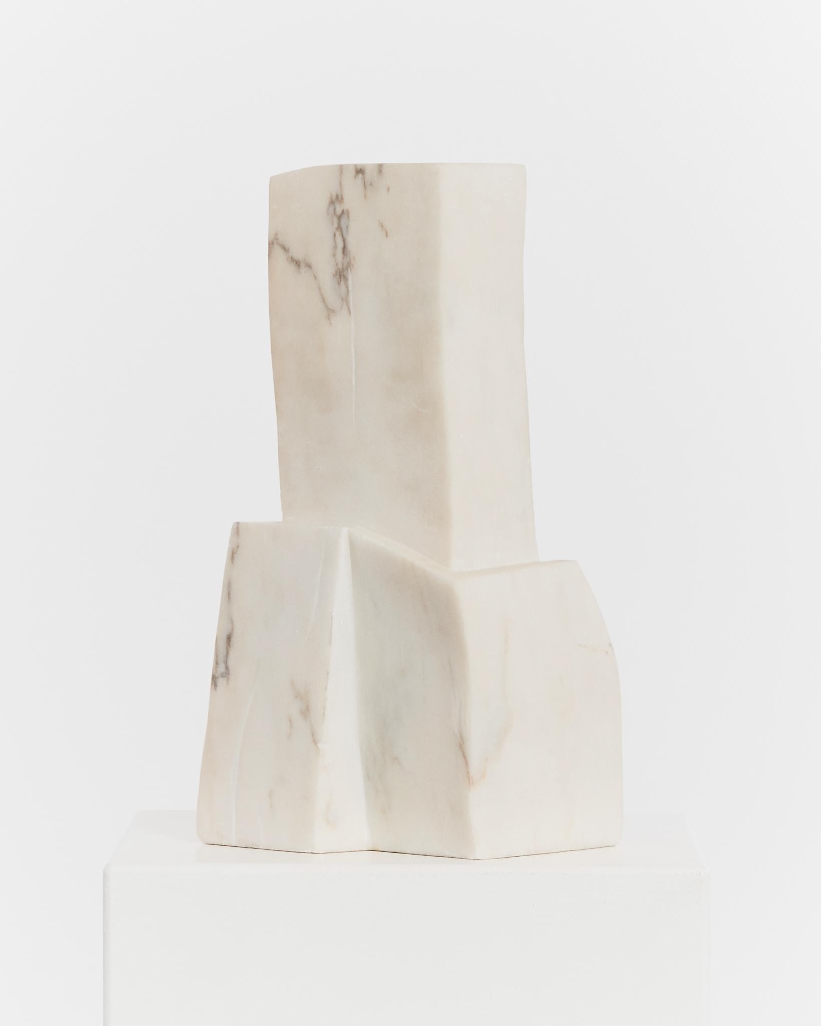 Carved from a single piece of Carrara marble, this modernist piece is architectural in form, featuring subtle veining that dates the Carrara piece from the 1970's.

Material: Carrara marble
Period: 1970's
Dimensions: H40 x W20 x D16cm
Condition: