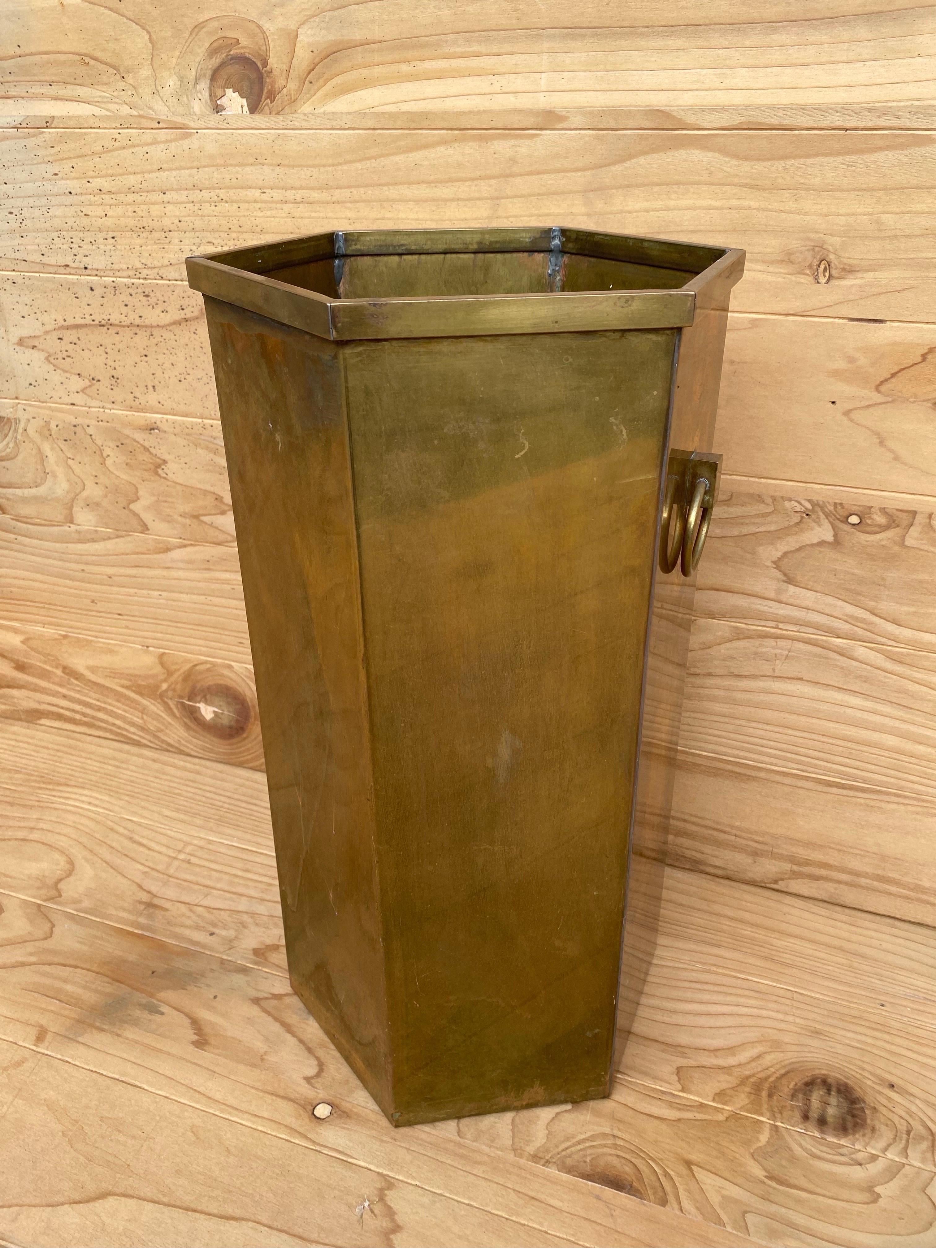 Antique Bronze Umbrella Stand
This antique bronze bin can have multiple uses in your home or office. From umbrella stand to wastepaper bin this antique will elevate your space with bronze warmth. 

Circa Early 20th Century

Dimensions:

W 9”
D