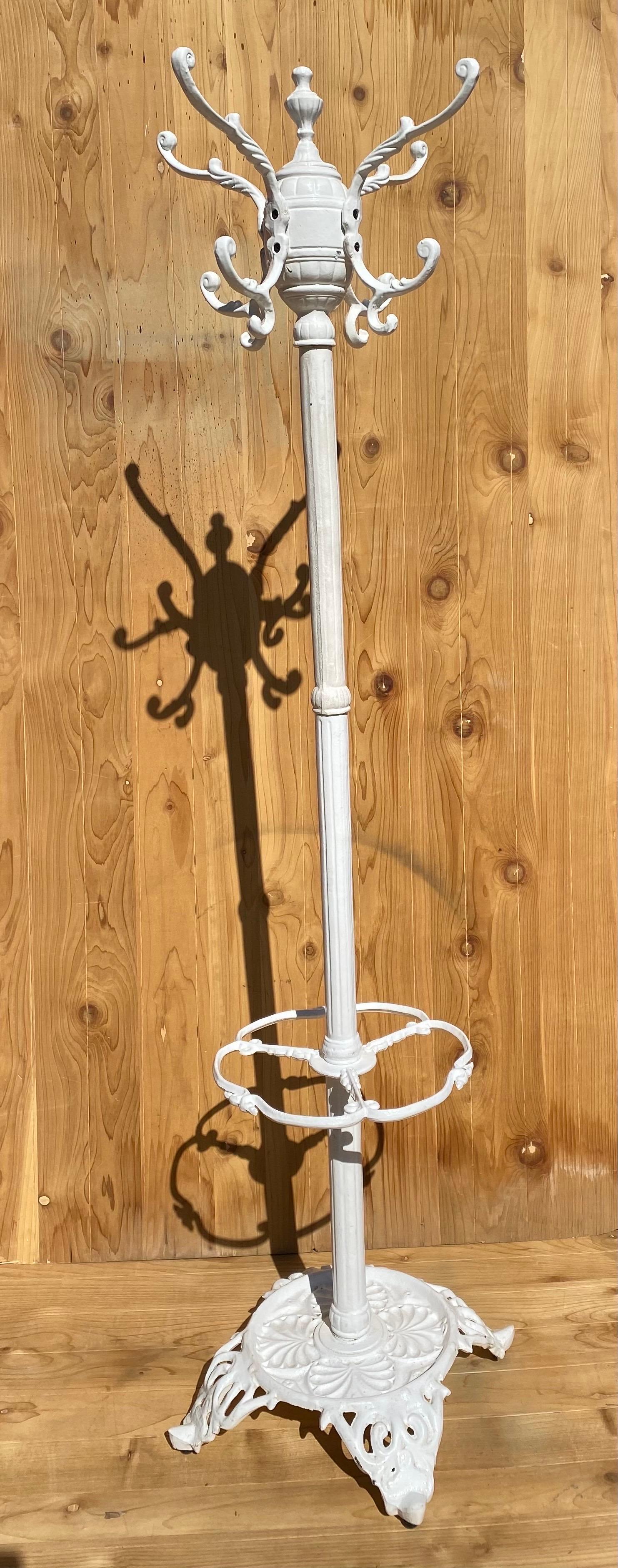 Antique Cast Wrought Iron White Painted Hall Tree

This ornate white hall tree would be a practical and beautiful additional to your entryway or mudroom. With multiple hooks for coats and ample space for umbrellas, it can service all your guests'