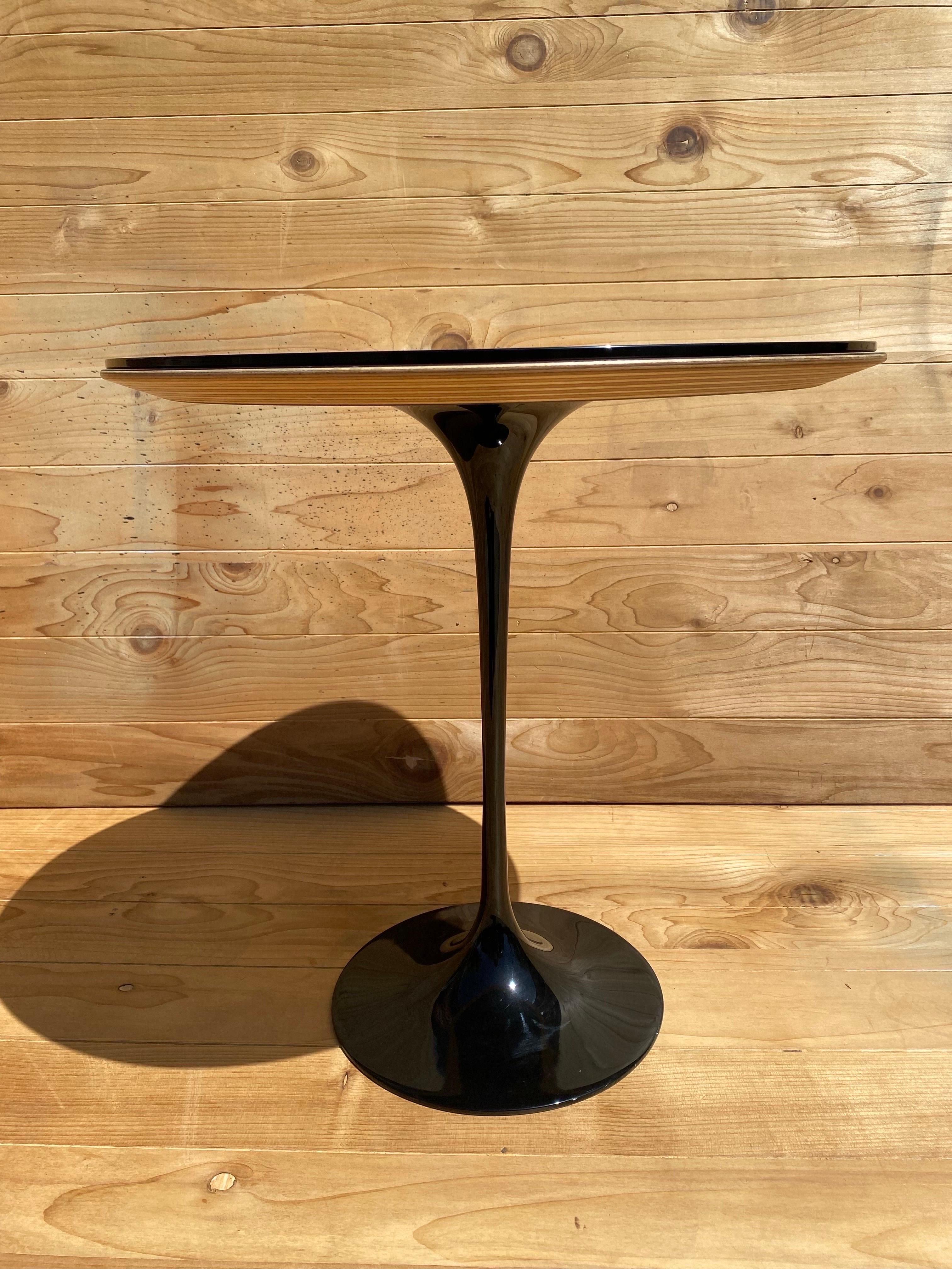 Mid Century Modern Eero Saarinen Black Tulip Table with Removable Tinted Glass Top

The Mid Century Modern Eero Saarinen Black Tulip Table with a removable tinted glass top is a timeless and iconic piece of furniture. Designed by Eero Saarinen in
