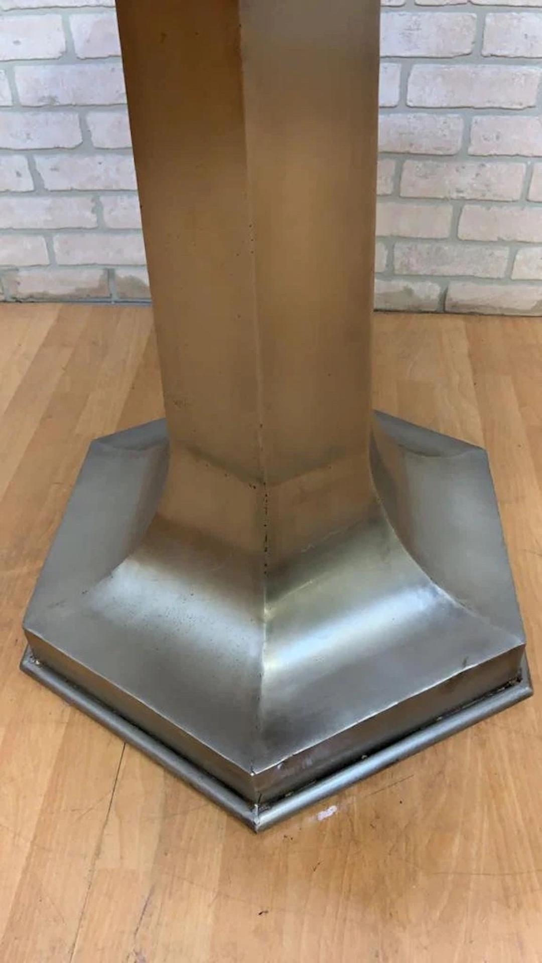 Mid Century Modern Structural Metal Octagonal Pedestal Base Italian Marble Top Hall/Flower/Cocktail/Dinette Table

Crafted with a sleek and sturdy metal base, this table showcases a unique octagonal design that adds a touch of modern elegance. The