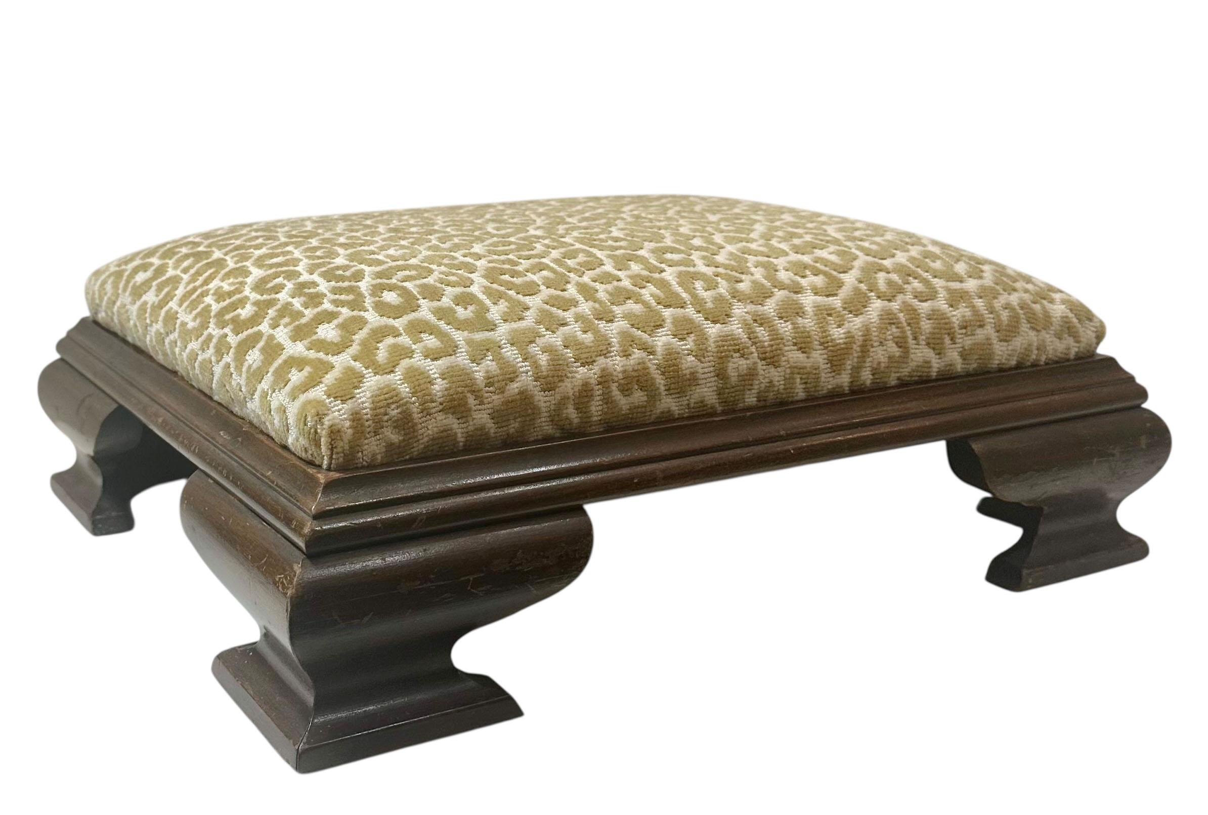 A beautifully proportioned Chippendale style bench, dating to the turn of the century, upholstered in a rich and vibrant Scalamandré fabric from the 1980s. The bench features classic Chippendale details, including elegantly carved legs showcasing
