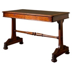 Early Victorian mahogany and black leather writing table by Johnstone & Jeanes