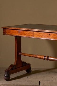 Early Victorian mahogany and black leather writing table by Johnstone & Jeanes