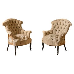 Napoleon III French buttoned back and seat fishtail armchairs