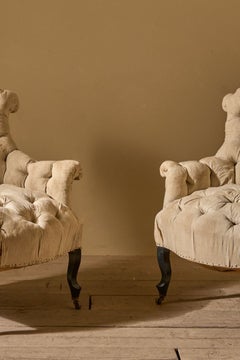 Napoleon III French buttoned back and seat fishtail armchairs