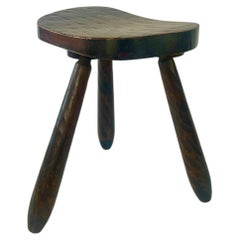 Vintage rustic brutalist carved wood tripod stool. France, c.1930-50