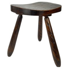 Vintage rustic brutalist carved wood tripod stool. France, c.1930-50