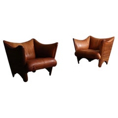 Pair Of Mid-Century Lounge Chairs In Cognac Leather And Wood By Pacific Green, A
