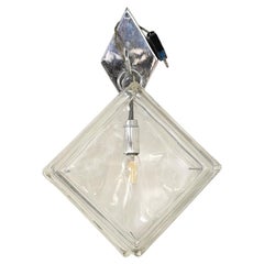 Wall sconce made of pressed glass and metal, manufactured in Europe, 1970s