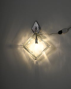 Wall sconce made of pressed glass and metal, manufactured in Europe, 1970s