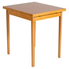 Extendable beech dining table with a laminate top, Sweden, 1950s–1960s