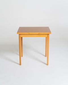 Extendable beech dining table with a laminate top, Sweden, 1950s–1960s