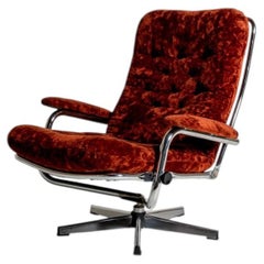 Swedish swivel armchair in velvet and steel, 1970s