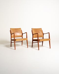 Pair of Scandinavian faux-leather armchairs, 1960s