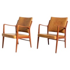 Pair of Scandinavian faux-leather armchairs, 1960s