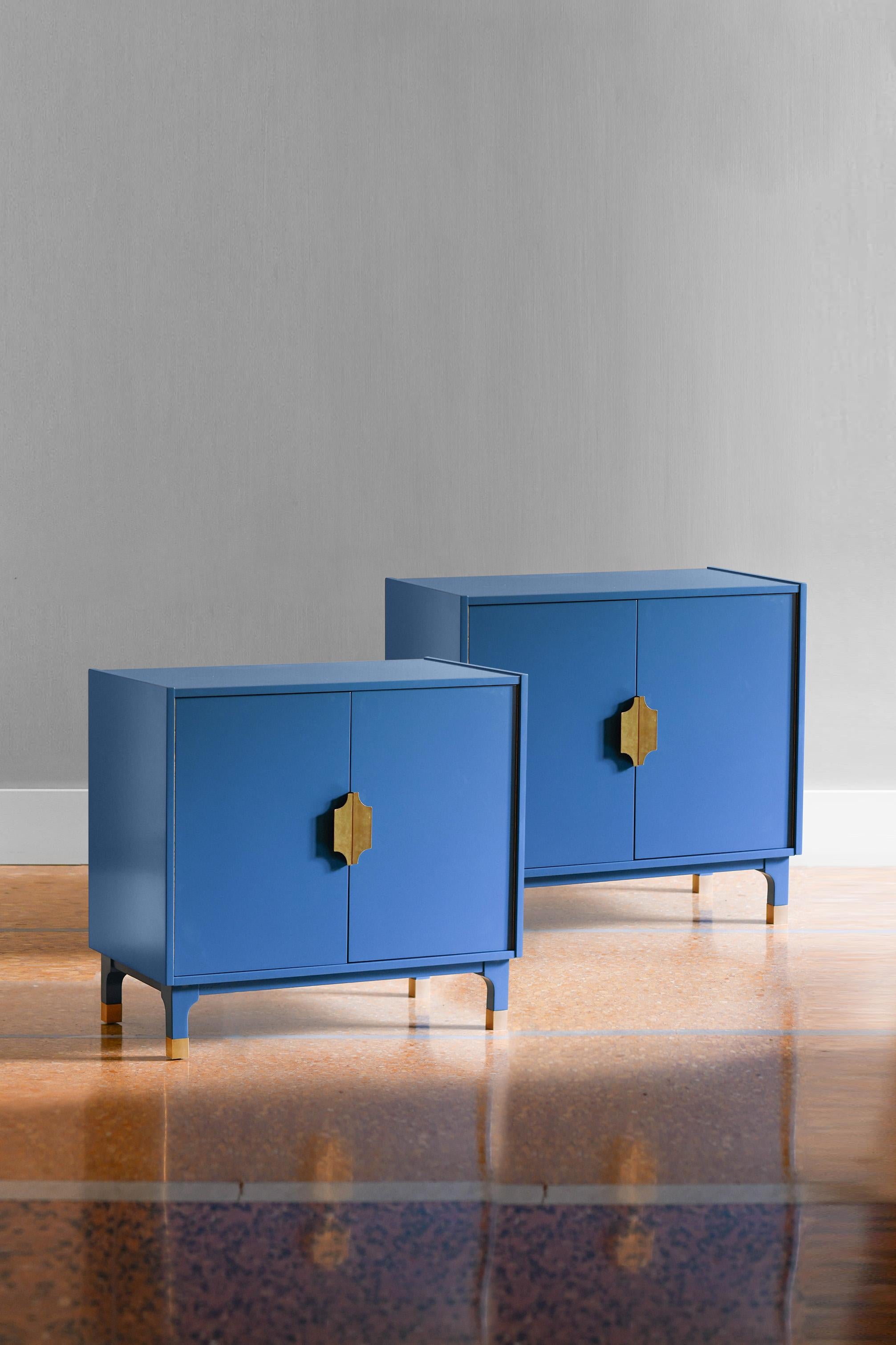 Pair of Mid-Century consoles in lacquered wood with brass details. For Sale