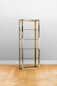 Brass and chromed metal bookcase with glass shelves, Italy 1980