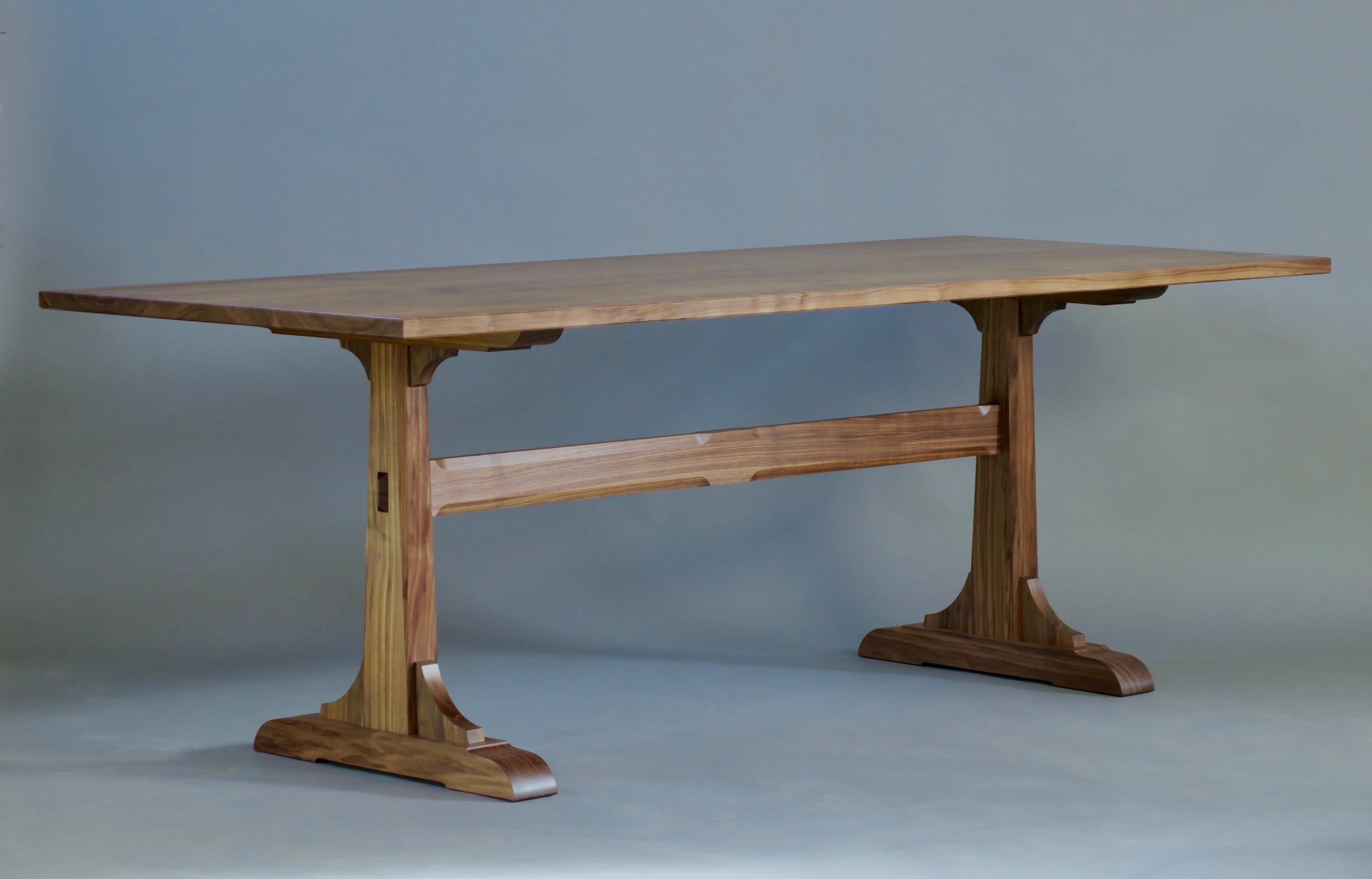 The Granero dining table is a stunning piece crafted from rich Pennsylvania walnut, measuring 34