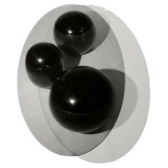 Table basse sculpturale en marbre noir et verre Ovni Uovo