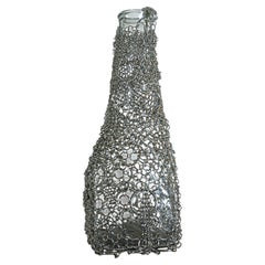 Vaso “Floating Chainmail”, realizzato in Steele e vetro, di Panorammma, Messico